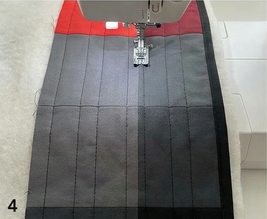 Ombre Red to Black Quilt for Dramatic Sofa Drape in Combined Room