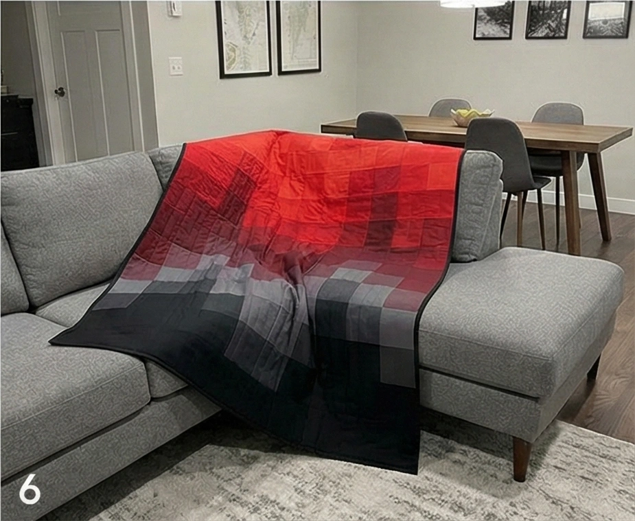 Ombre Red to Black Quilt for Dramatic Sofa Drape in Combined Room