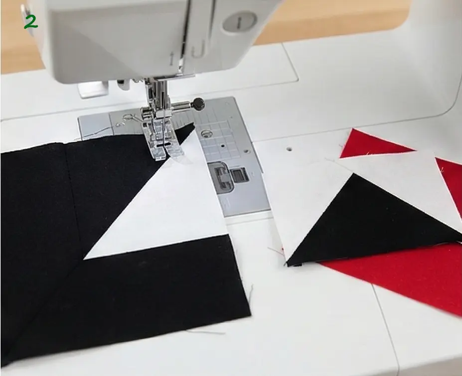 Scandinavian-Inspired Red, Black, and White Quilts for a Minimal Living Room