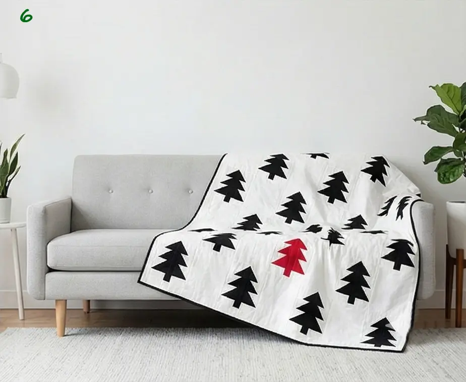 Scandinavian-Inspired Red, Black, and White Quilts for a Minimal Living Room